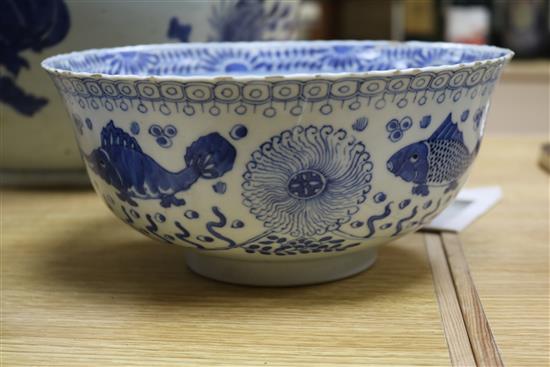A 19th century Chinese blue and white punch bowl, Diameter 35cm. and three other bowls (a.f.)